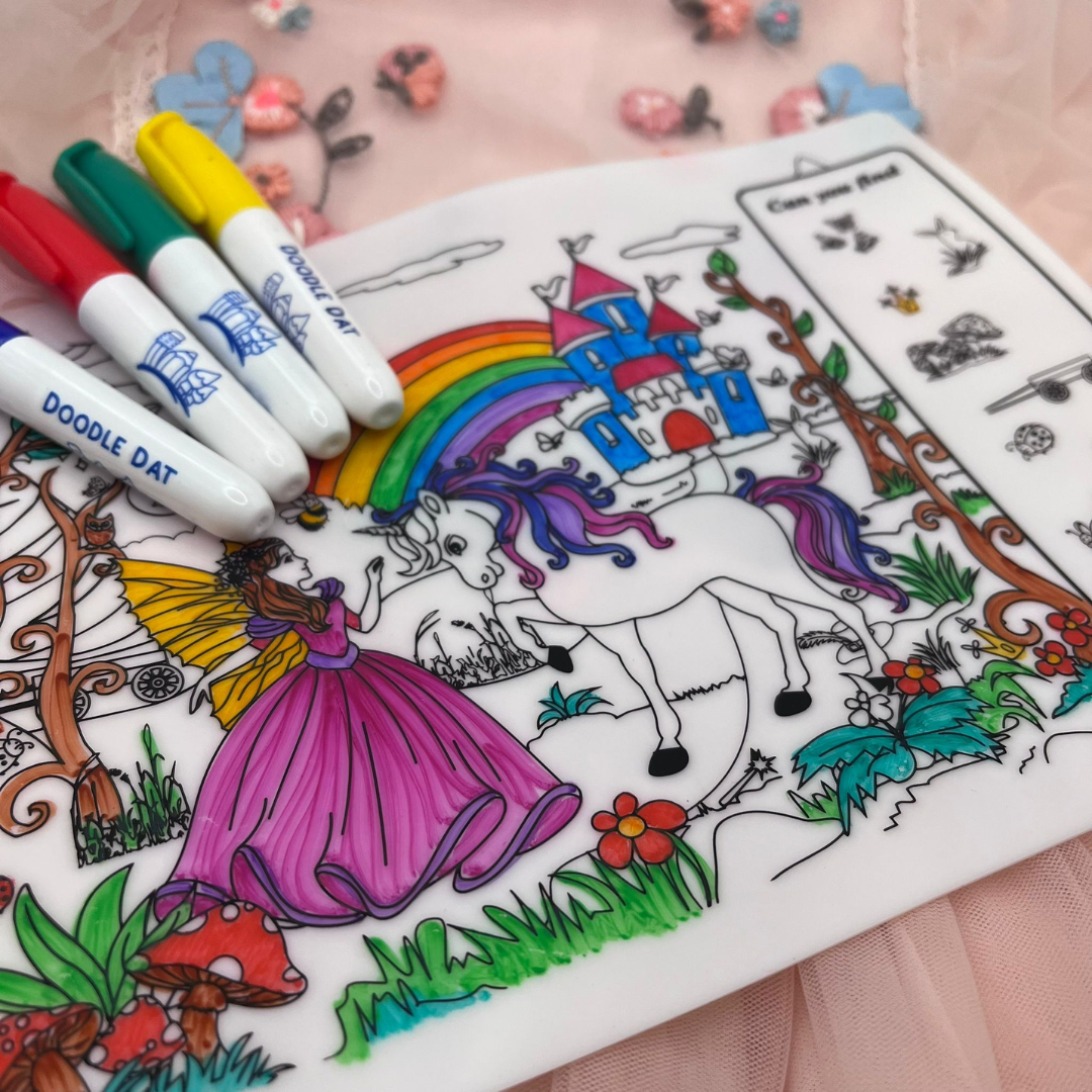 Coloring mat with a fairy and unicorn design, colored with markers.