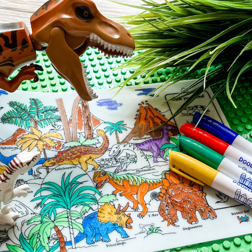 Coloring mat with dinosaur illustrations, markers. 